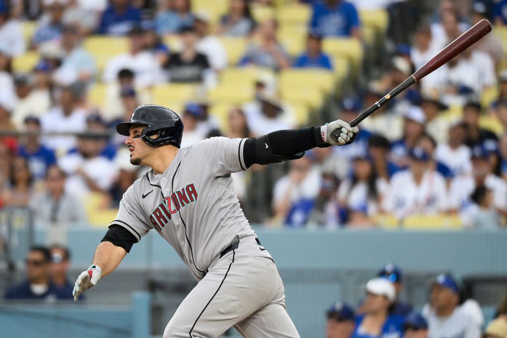 Arizona Diamondbacks' Nolan Arenado watches his RBI double during the fifth inning of a baseball game against the Los Angeles Dodgers in Los Angeles, Sunday, July 12, 2026. (AP Photo/Kyusung Gong)