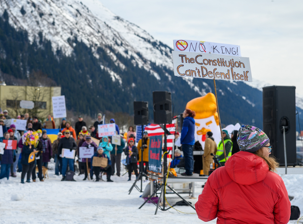 Demonstrators participate in a "No Kings" protest in Juneau, Alaska, on Saturday, March 28, 2026. (Jasz Garrett/Juneau Independent via AP)