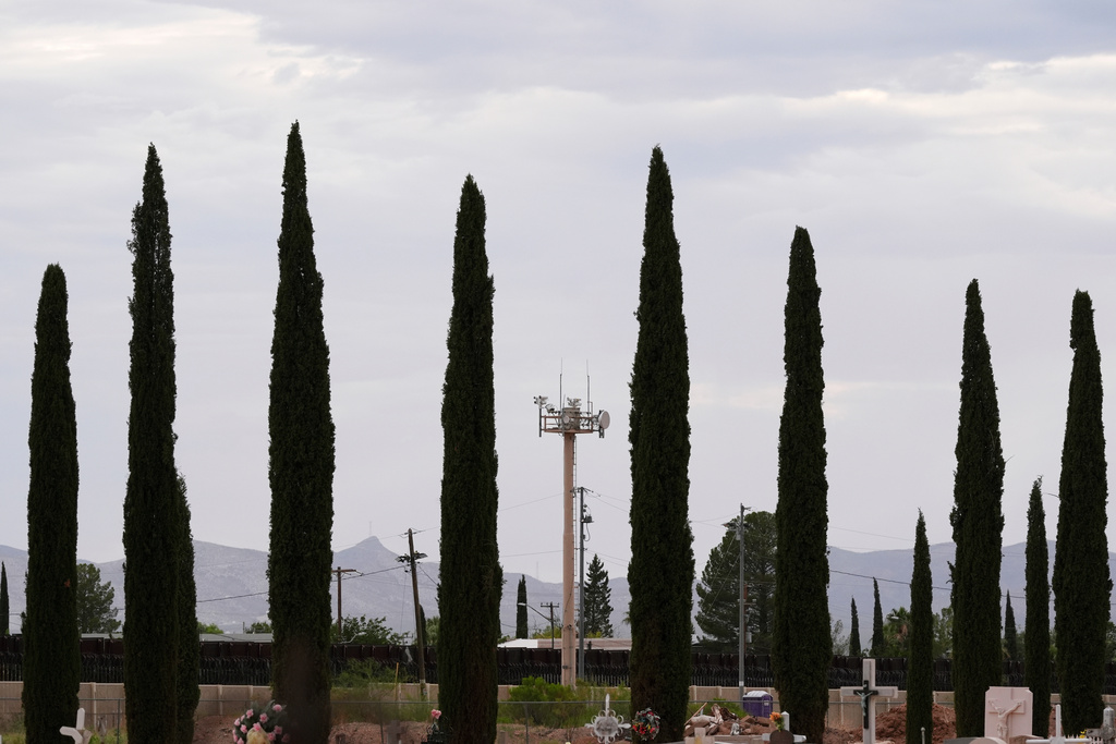 Surveillance technology used by various law enforcement jurisdictions sit on a tower at the border wall, Monday, July 28, 2025, in Douglas, Ariz. (AP Photo/Ross D. Franklin)