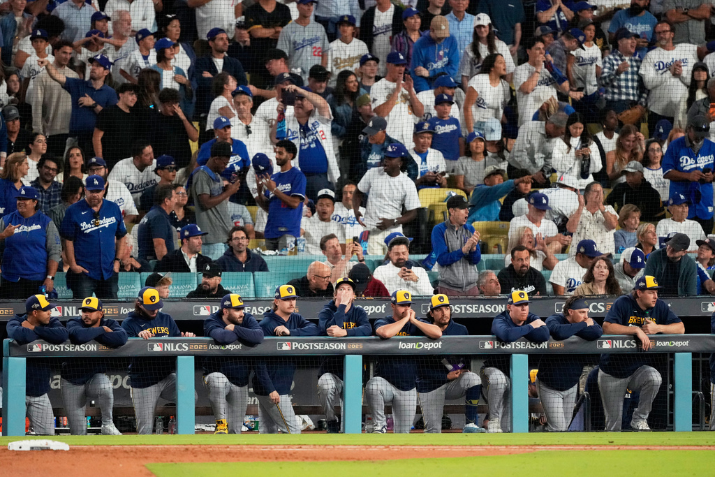 Members of the Milwaukee Brewers watch during the eighth inning in Game 4 of baseball's National League Championship Series against the Los Angeles Dodgers, Friday, Oct. 17, 2025, in Los Angeles. (AP Photo/Mark J. Terrill)