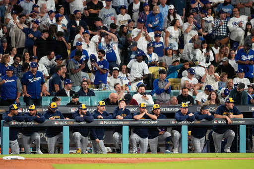 Members of the Milwaukee Brewers watch during the eighth inning in Game 4 of baseball's National League Championship Series against the Los Angeles Dodgers, Friday, Oct. 17, 2025, in Los Angeles. (AP Photo/Mark J. Terrill) Members of the Milwaukee Brewers watch during the eighth inning in Game 4 of baseball's National League Championship Series against the Los Angeles Dodgers, Friday, Oct. 17, 2025, in Los Angeles. (AP Photo/Mark J. Terrill)