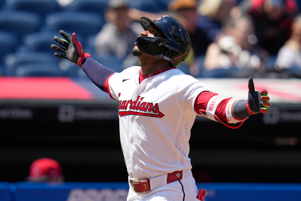 Cleveland Guardians' Angel Martínez gestures as he runs towards home plate in the first inning of a baseball game against the Los Angeles Angels in Cleveland, Wednesday, May 13, 2026. (AP Photo/Sue Ogrocki)