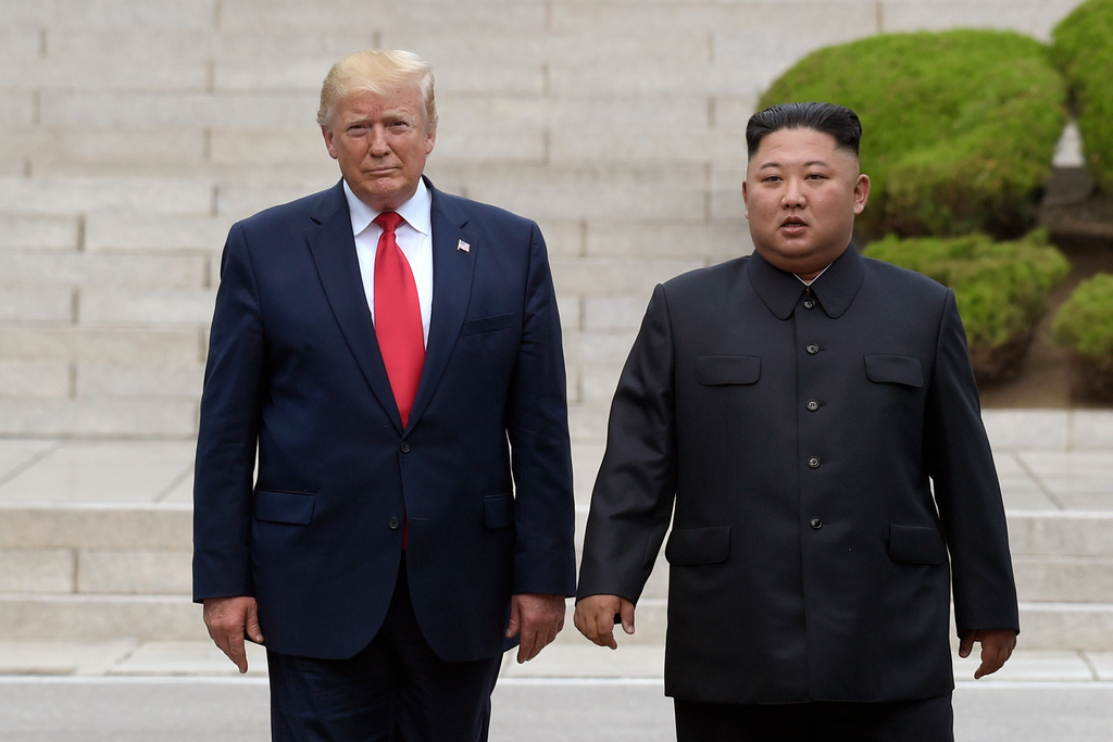 FILE - Then U.S. President Donald Trump, left, meets with North Korean leader Kim Jong Un at the North Korean side of the border at the village of Panmunjom in Demilitarized Zone, on June 30, 2019. (AP Photo/Susan Walsh, File)
