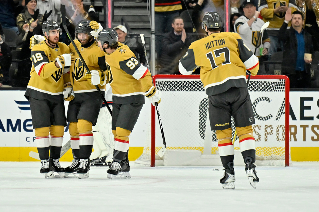 Vegas Golden Knights players celebrate after a goal against the Columbus Blue Jackets during the first period of an NHL hockey game Thursday, Jan. 8, 2026, in Las Vegas. (AP Photo/David Becker)
