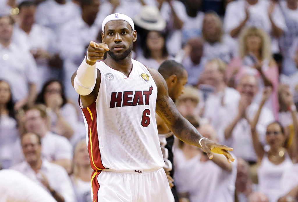 FILE - Miami Heat's LeBron James (6) gestures after a play against the San Antonio Spurs during the first half in Game 7 of the NBA basketball championships, June 20, 2013, in Miami. (AP Photo/Lynne Sladky, File)