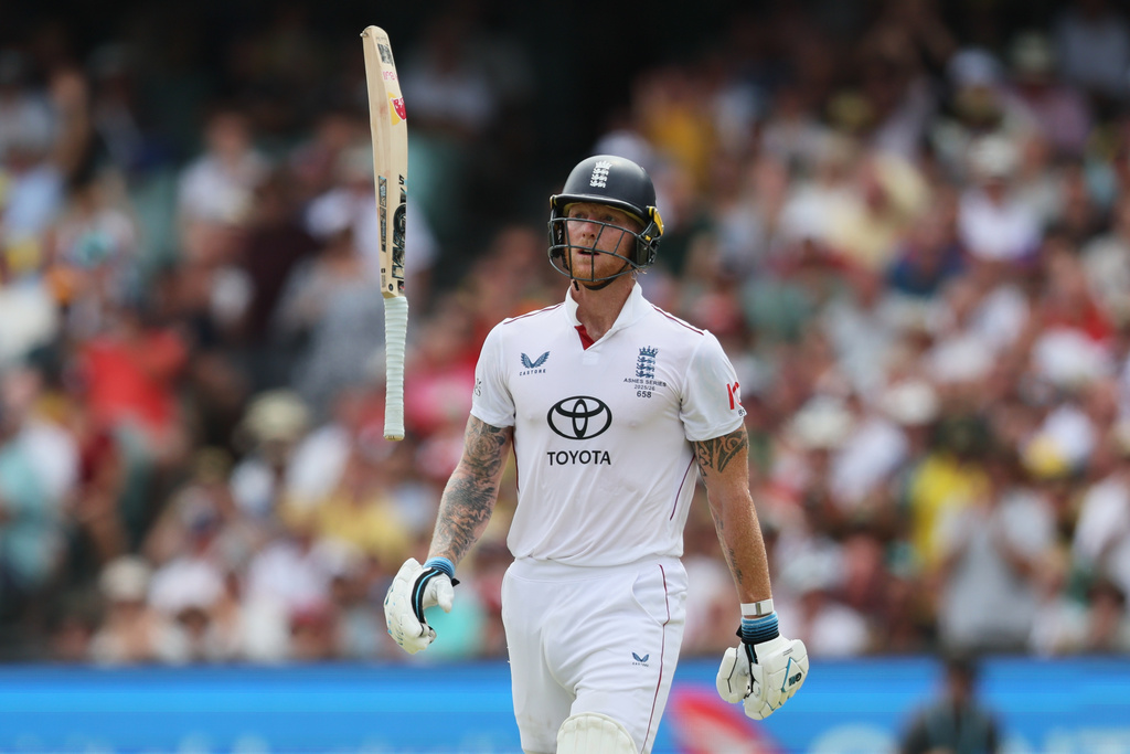 England's Ben Stokes throws his bat as he reacts after he was out bowled during play on day three of the third Ashes cricket test between England and Australia in Adelaide, Australia, Friday, Dec. 19, 2025. (AP Photo/James Elsby)
