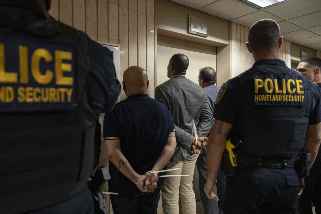Federal agents detain the elected officials after they demand access to inspect the detention facility at the immigration court at the Jacob K. Javits federal building, Thursday, Sept. 18, 2025, in New York. (AP Photo/Yuki Iwamura)