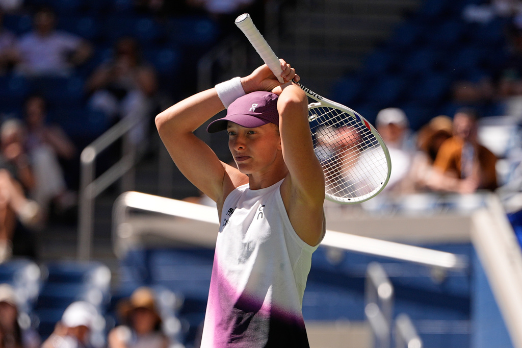 Iga Swiatek, of Poland, reacts during a match against Qinwen Zheng, of China, during the fourth round of the U.S. Open tennis championships, Monday, Sept. 7, 2026, in New York. (AP Photo/Seth Wenig)