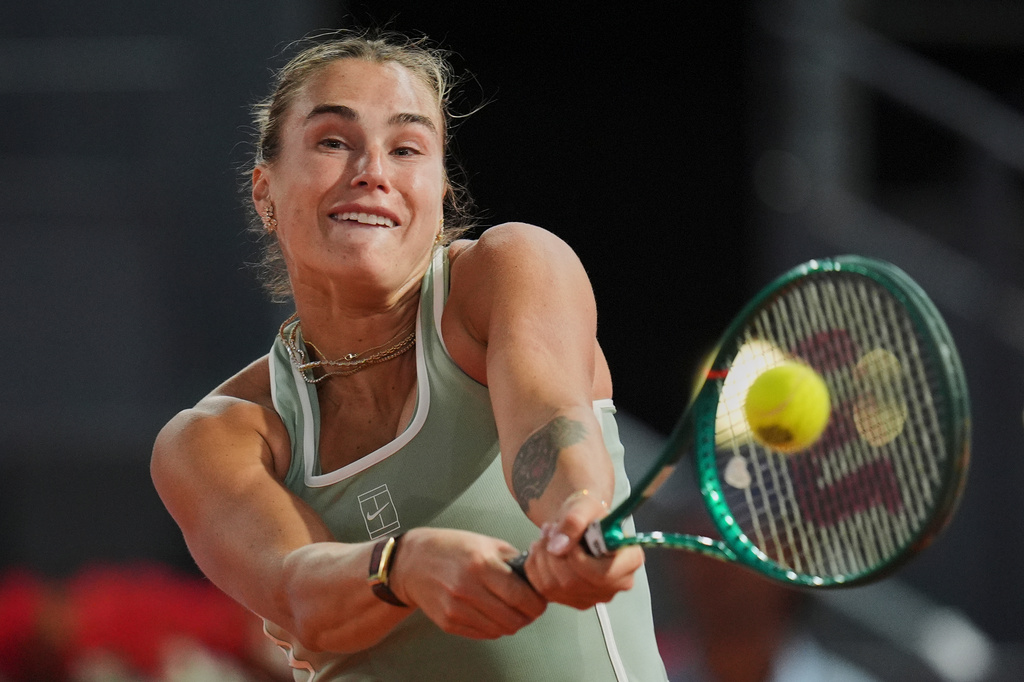 Aryna Sabalenka, of Belarus, returns the ball to Hailey Baptiste, of the United States, during the Madrid Open tennis tournament in Madrid, Tuesday, April 28, 2026. (AP Photo/Manu Fernandez)
