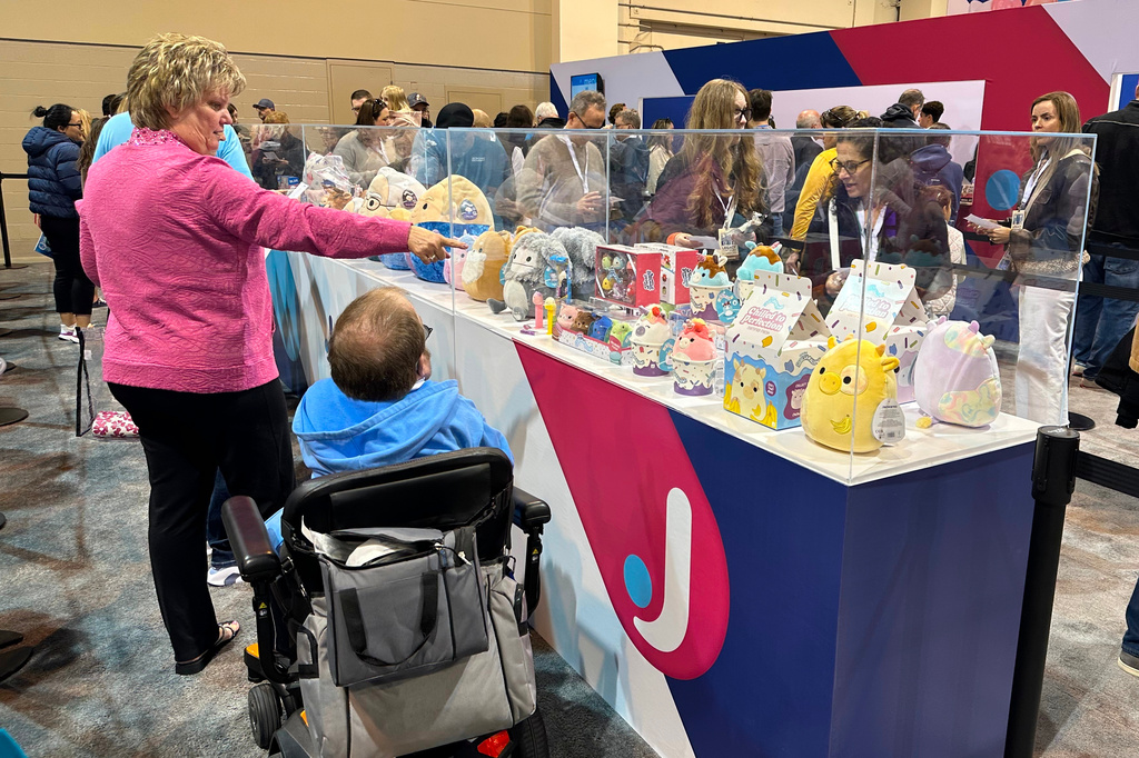 Berkshire Hathaway shareholders stand in line to purchase Squishmallows versions of the company's top executives: CEO Greg Abel, Chairman Warren Buffett and former Vice Chairman Charlie Munger on Friday, May 1, 2026 in Omaha, Neb. (AP Photo/Josh Funk)
