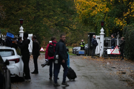 Journalists wait at an entrance near to the Royal Lodge, following the announcement that Prince Andrew will be stripped of his titles and leave the 30-room mansion he has occupied for more than 20 years in Windsor, England, Friday, Oct. 31, 2025.(AP Photo/Alastair Grant) Journalists wait at an entrance near to the Royal Lodge, following the announcement that Prince Andrew will be stripped of his titles and leave the 30-room mansion he has occupied for more than 20 years in Windsor, England, Friday, Oct. 31, 2025.(AP Photo/Alastair Grant)