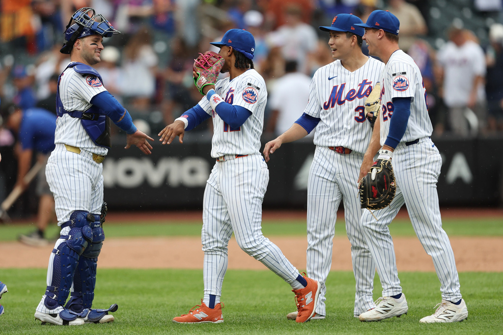 New York Mets catcher Luis Torrens and shortstop Francisco Lindor celebrate after a win over the Washington Nationals in the ninth inning of a baseball game, Sunday, Aug. 16, 2026, in New York. (AP Photo/Heather Khalifa)
