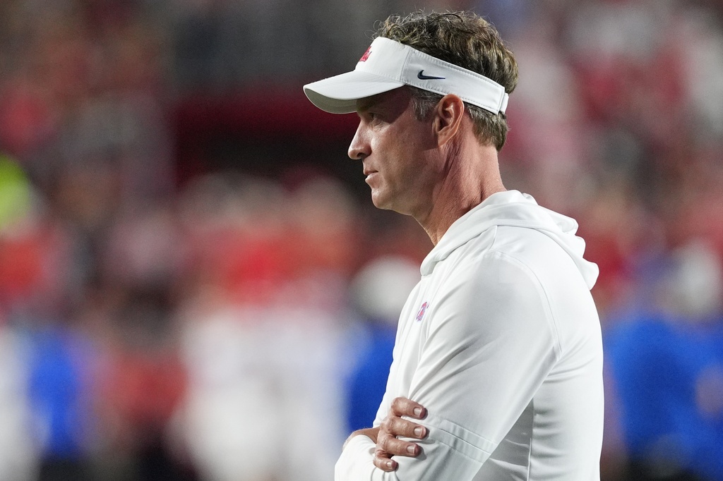 Mississippi head coach Lane Kiffin, watches his team warm up prior to the start of an NCAA college football game against Florida, Saturday, Nov. 15, 2025, in Oxford, Miss. (AP Photo/Rogelio V. Solis)