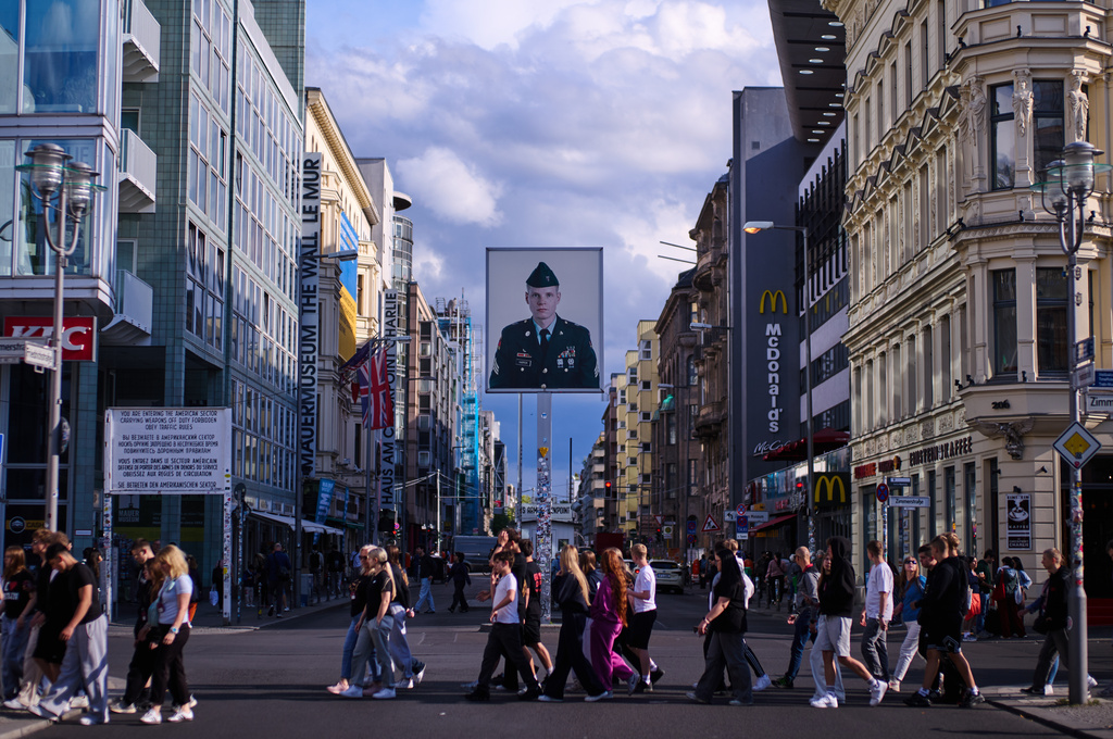 An iconic portrait of U.S. Army sergeant Jeff Harper, by artist Frank Thiel, is displayed at the former allied Checkpoint Charlie, which marks the border between former East and West Berlin during the Cold War until the fall of the wall, in Berlin, Germany, Thursday, June 11, 2026. (AP Photo/Markus Schreiber)