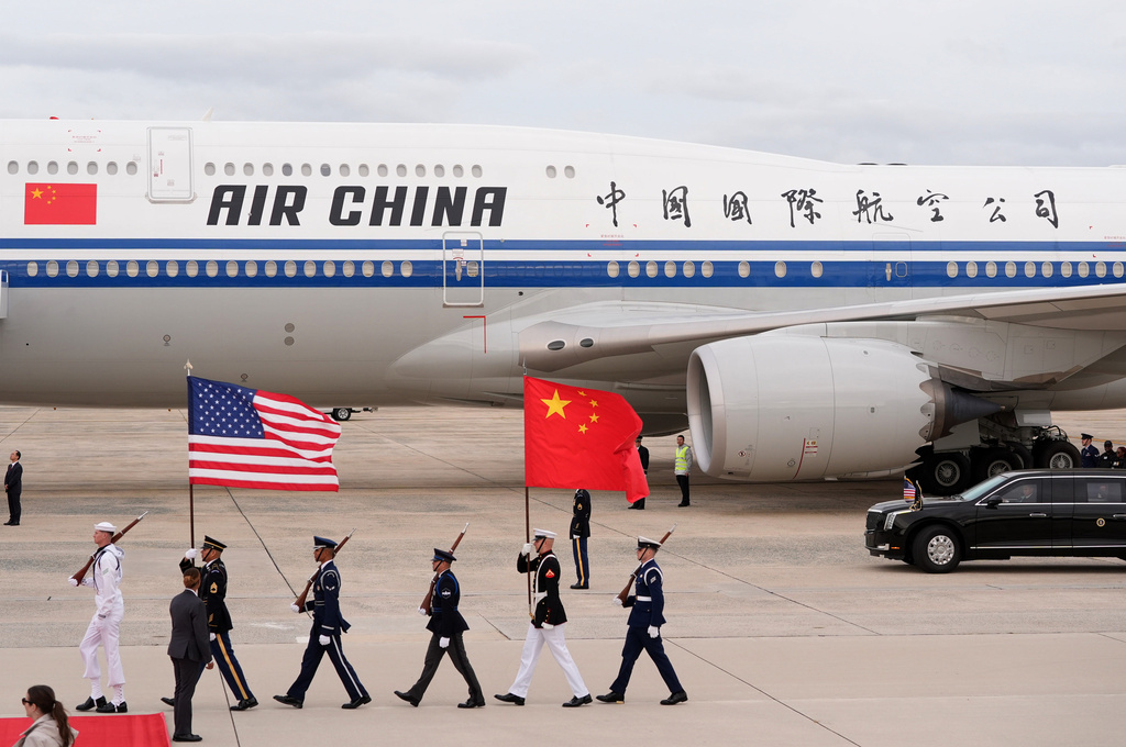 Flags are marched in as an Air China airplane with Chinese President Xi Jinping and his wife Peng Liyuan aboard, arrives at Joint Base Andrews, Md., Wednesday, Sept. 23, 2026. (AP Photo/Mark Schiefelbein)