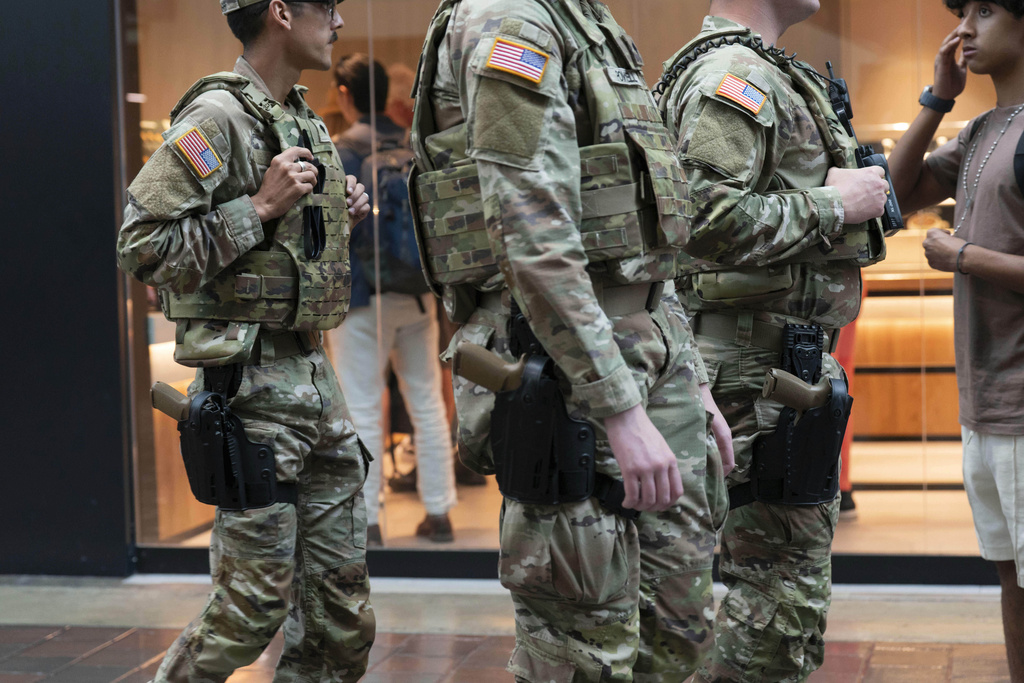 Members of the Louisiana National Guard patrol at Union Station, Tuesday, Aug. 26, 2025, in Washington. (AP Photo/Jose Luis Magana)