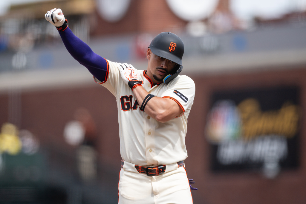 San Francisco Giants' Willy Adames reacts after hitting a single during the eighth inning of a baseball game against the Colorado Rockies, Sunday, July 12, 2026, in San Francisco. (AP Photo/Thien-An Truong)