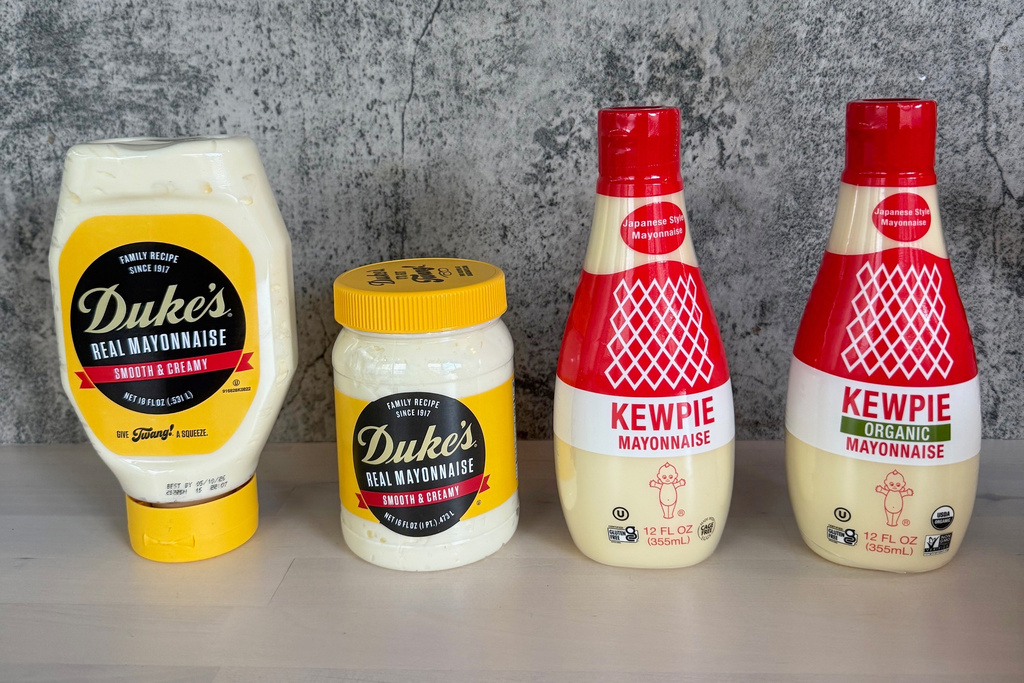 This image shows specialty condiments Duke’s Mayo, a century-old Southern classic, left, and Japanese Kewpie mayo. (Katie Workman via AP)