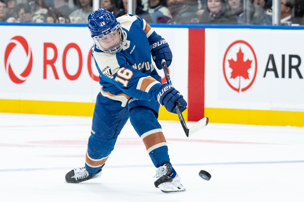 Vancouver Goldeneyes' Sophie Jaques (16) shoots the puck against the New York Sirens during the third period of a PWHL hockey game in Vancouver, British Columbia, Wednesday, March 18, 2026. (Ethan Cairns/The Canadian Press via AP)