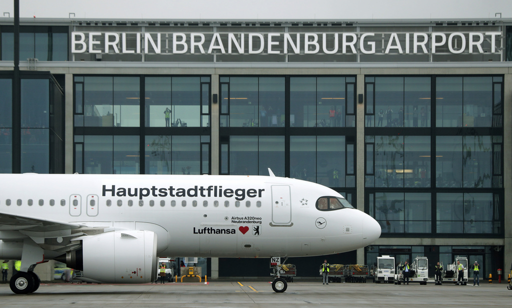 FILE - A 'Lufthansa' ariplane is parked in front of Terminal 1 after its arrival at the new Berlin-Brandenburg-Airport 'Willy Brandt' in Berlin, Germany, Saturday, Oct. 31, 2020. (AP Photo/Michael Sohn, File)