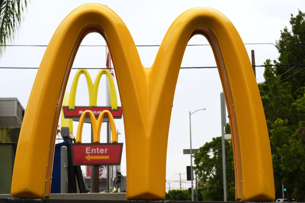 FILE - McDonald's Golden Arches signs are seen, March 31, 2026, in Los Angeles. (AP Photo/Damian Dovarganes, File)