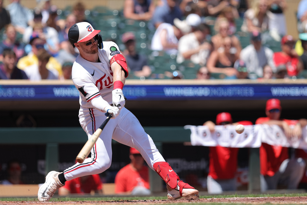 Minnesota Twins' Ryan Jeffers hits a two-run double during the third inning of a baseball game against the Los Angeles Angels, Sunday, July 12, 2026, in Minneapolis. (AP Photo/Bailey Hillesheim)
