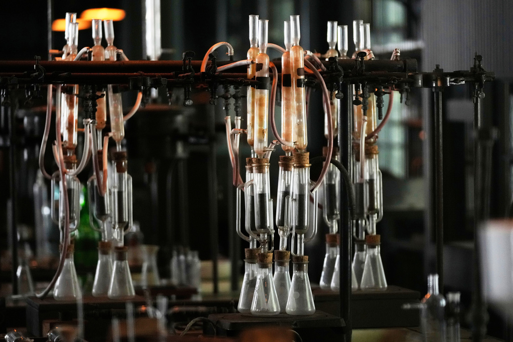 Glass beakers are displayed at the Edison Botanic Research Laboratory at the Edison and Ford Winter Estates, Saturday, Aug. 9, 2025, in Fort Myers, Fla. (AP Photo/Lynne Sladky)