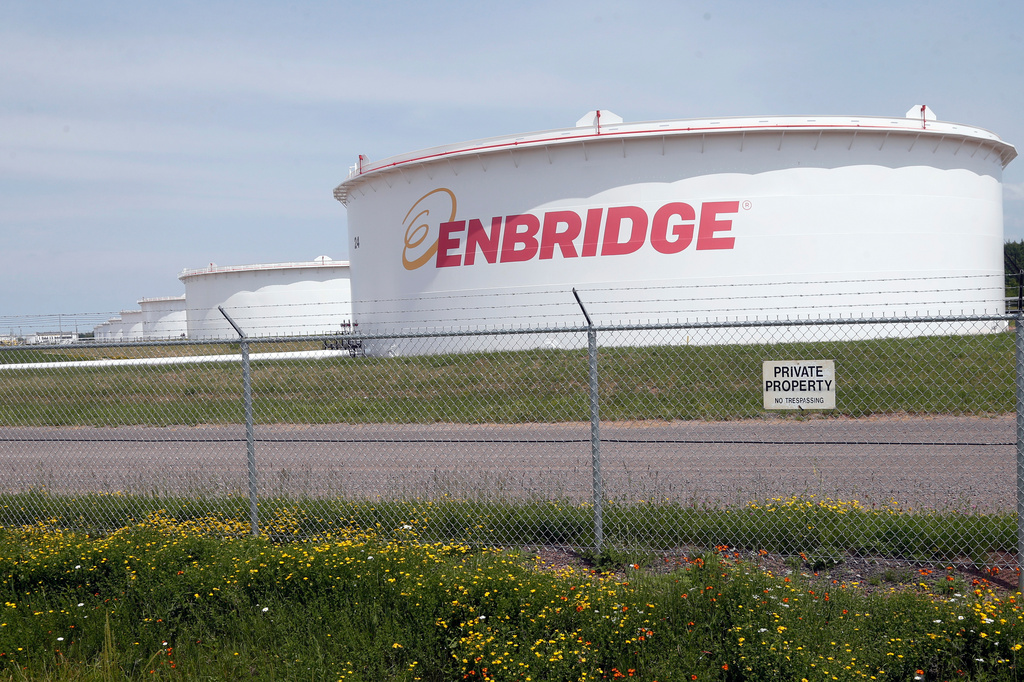FILE - The corporate name is displayed on tanks at the Superior terminal of Enbridge Energy in Superior, Wis., on June 29, 2018. (AP Photo/Jim Mone, File)