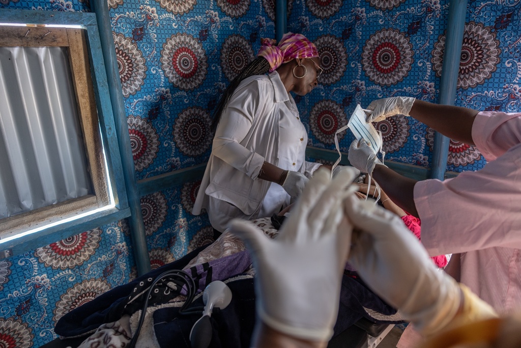 A young Malian woman is treated for her dangerously high fever and infection by doctors at the Douankaran health clinic in the Hodh El Chargui Region, Mauritania, Nov. 7, 2025. (AP Photo/Caitlin Kelly)