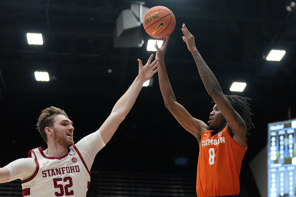 Clemson forward Dallas Thomas (8) makes a 3-point shot against Stanford forward Aidan Cammann (52) during the first half of an NCAA college basketball game in Stanford, Calif., Wednesday, Feb. 4, 2026. (AP Photo/Tony Avelar)