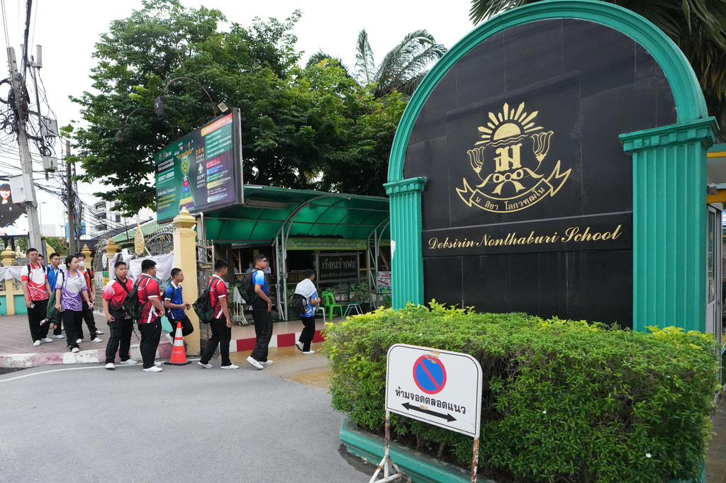 Students arrive at Debsirin Nonthaburi School, a day after the shooting at the school, in Nonthaburi province, Thailand Saturday, Aug. 8, 2026. (AP Photo/Sakchai Lalit)