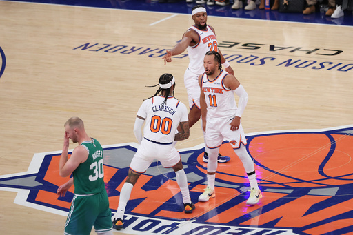 New York Knicks' Jalen Brunson (11) and Guerschon Yabusele (28) celebrate with Jordan Clarkson (00) after his three-point basket while Boston Celtics' Sam Hauser (30) returns to the bench during the first half of an NBA basketball game, Friday, Oct. 24, 2025, in New York. (AP Photo/Heather Khalifa) New York Knicks' Jalen Brunson (11) and Guerschon Yabusele (28) celebrate with Jordan Clarkson (00) after his three-point basket while Boston Celtics' Sam Hauser (30) returns to the bench during the first half of an NBA basketball game, Friday, Oct. 24, 2025, in New York. (AP Photo/Heather Khalifa)