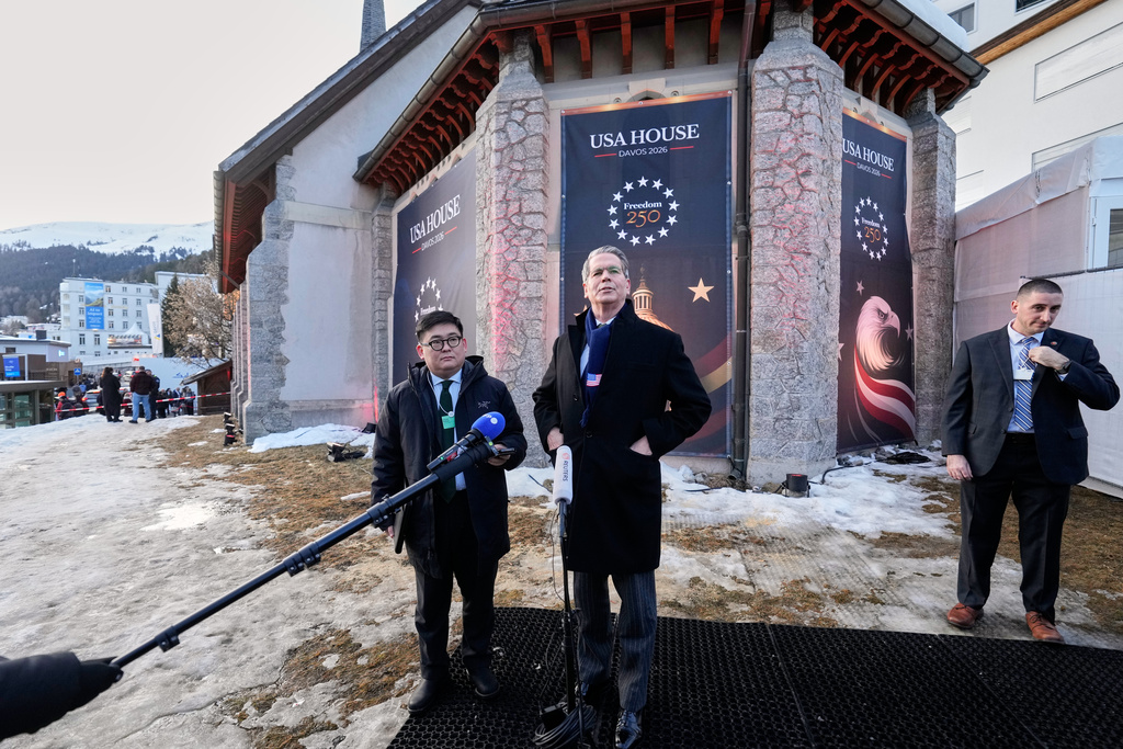Scott Bessent, US Secretary of the Treasury, talks to media representatives at the USA House on the sidelines of the Annual Meeting of the World Economic Forum in Davos, Switzerland, Monday, Jan. 19, 2026. (AP Photo/Markus Schreiber)