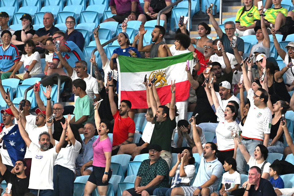 Iranian supporters react during the Women's Asia Cup soccer match between Iran and South Korea on the Gold Coast, Australia, Monday, March 2, 2026. (Dave Hunt/AAPImage via AP)