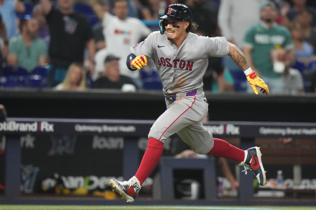 Boston Red Sox's Jarren Duran runs to score on a double hit by Mickey Gasper during the fifth inning of a baseball game against the Miami Marlins, Monday, Aug. 24, 2026, in Miami. (AP Photo/Lynne Sladky)