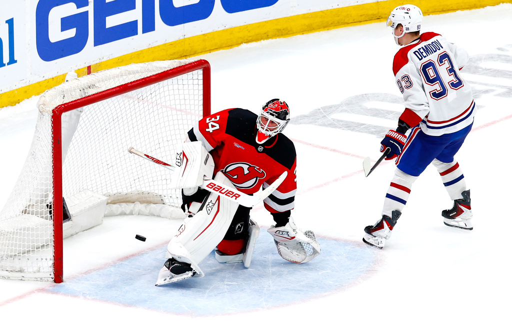 Montréal Canadiens right wing Ivan Demidov (93) scores against New Jersey Devils goaltender Jake Allen (34) during a shootout in an NHL hockey game, Saturday, April 4, 2026, in Newark, N.J. (AP Photo/Noah K. Murray)