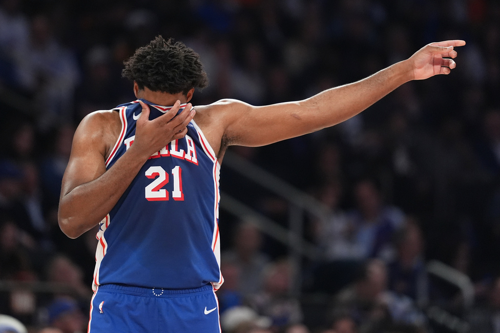 Philadelphia 76ers' Joel Embiid reacts during the first half of Game 1 in a second-round NBA basketball playoffs series against the New York Knicks Monday, May 4, 2026, in New York. (AP Photo/Seth Wenig)