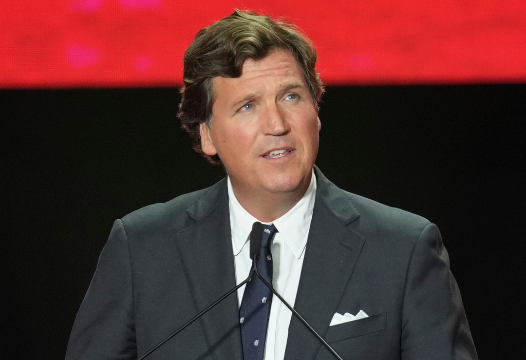 FILE - Tucker Carlson speaks at a memorial for Charlie Kirk, Sept. 21, 2025, in Glendale, Ariz. (AP Photo/Ross D. Franklin, File)
