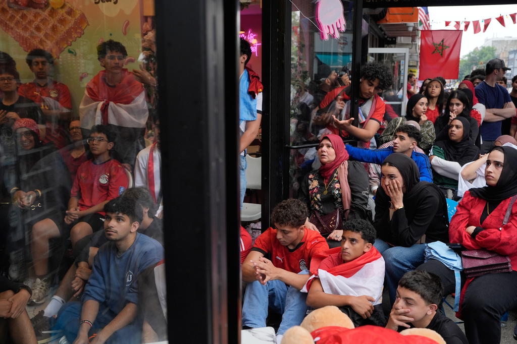 Egyptian soccer fans react as they watch the end of a World Cup soccer game between Egypt and Argentina, in New York, Tuesday, July 7, 2026. (AP Photo/Seth Wenig)
