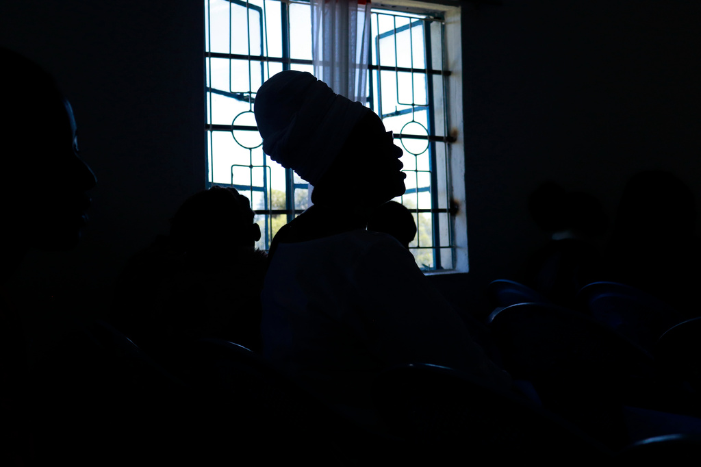 Quakerism faithful are silhouetted while singing during a church service in Kaimosi, Kenya, Sunday, Sept. 20, 2026. (AP Photo/Jackson Njehia)