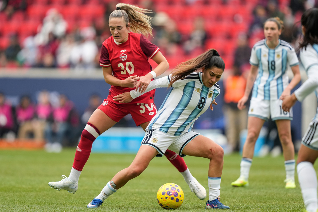 Argentina midfielder Daiana Falfán (8) fights for control of the ball with Canada forward Kaylee Hunter (30) during the first half of a SheBelieves Cup women's soccer match, Saturday, March 7, 2026, in Harrison, N.J. (AP Photo/Yuki Iwamura)