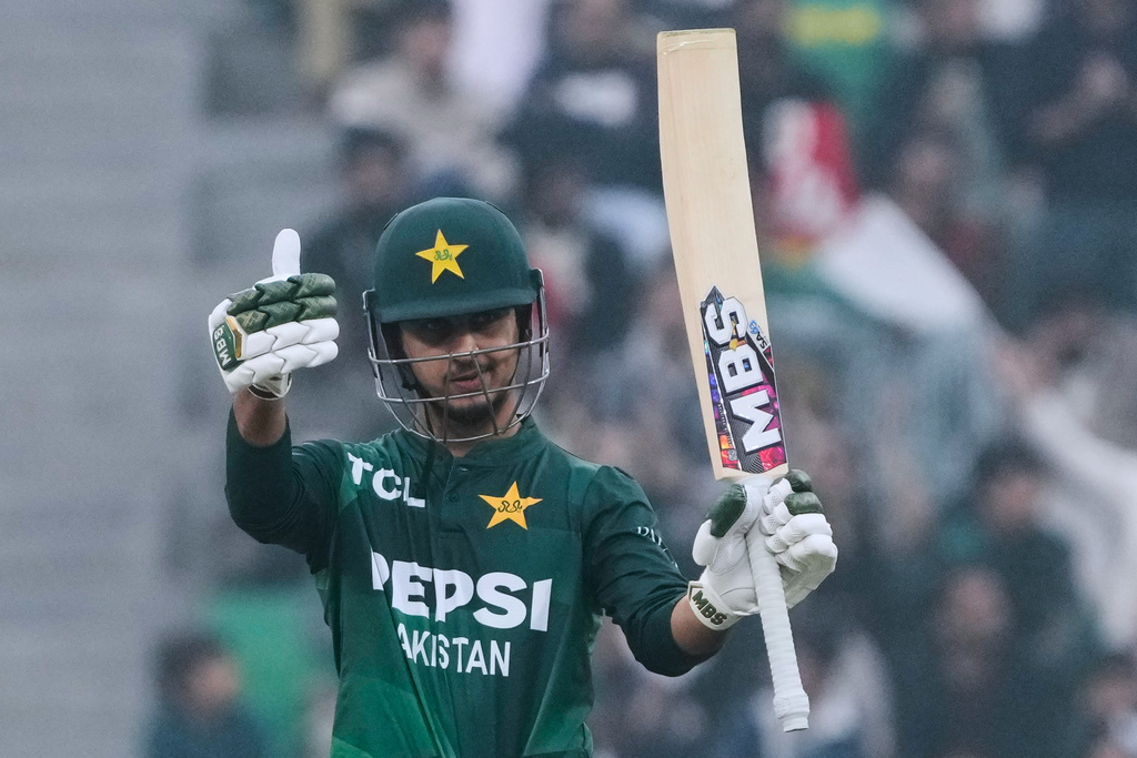 Pakistan's Saim Ayub celebrates after his fifty runs during the third T20 cricket match between Pakistan and Australia, in Lahore, Pakistan, Sunday, Feb. 1, 2026. (AP Photo/K.M. Chaudary)