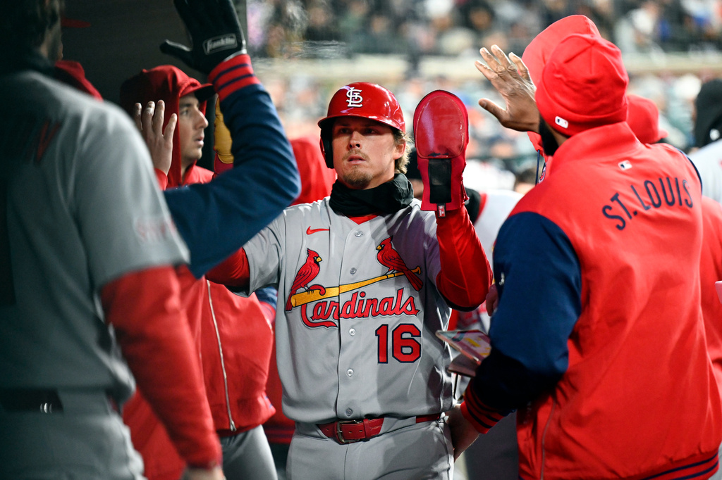 St. Louis Cardinals' Nolan Gorman (16) is congratulated in the dugout after scoring on an RBI single by Pedro Pagés in the fifth inning of a baseball game, Sunday, April 5, 2026, in Detroit. (AP Photo/Jose Juarez)