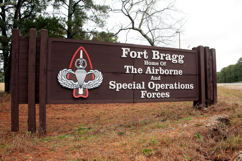 FILE - A sign at an entrance gate at Fort Bragg, N.C., is photographed on Jan. 4, 2020. (AP Photo/Chris Seward)