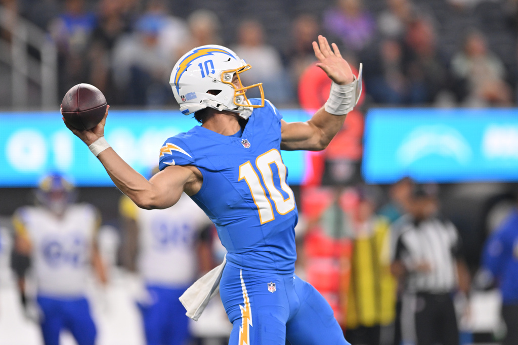 Los Angeles Chargers quarterback Justin Herbert throws a touchdown pass during the first half of an NFL preseason football game against the Los Angeles Rams Thursday, Aug. 27, 2026, in Inglewood, Calif. (AP Photo/Katie Chin)