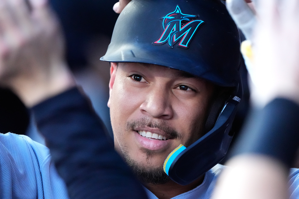 Miami Marlins' Heriberto Hernandez celebrates in the dugout after hitting a solo home run during the first inning of a baseball game against the Kansas City Royals, Thursday, Sept. 3, 2026, in Kansas City, Mo. (AP Photo/Charlie Riedel)