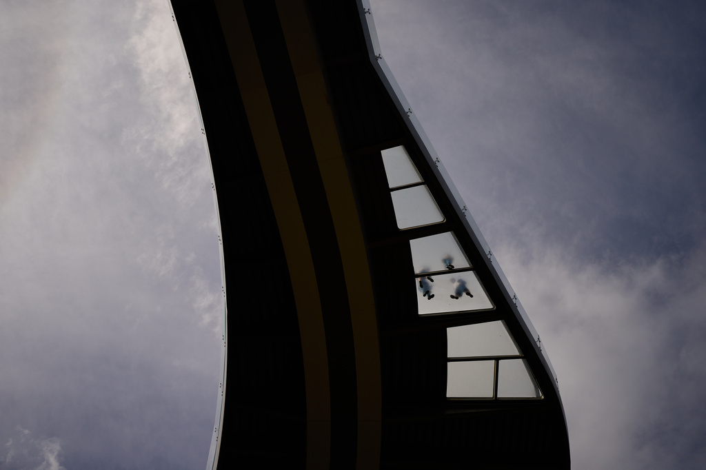 People walk along the Glass bridge in downtown Kyiv, Ukraine, Saturday, Sept. 5, 2026. (AP Photo/Francisco Seco)