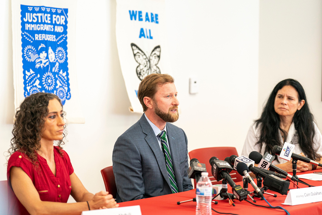 FILE - Cain Oulahan, center, Ramon Morales Reyes' immigration attorney addresses the media, May 30, 2025 in Milwaukee about the detention of his client Ramon Morales Reyes. (AP Photo/Andy Manis, File)