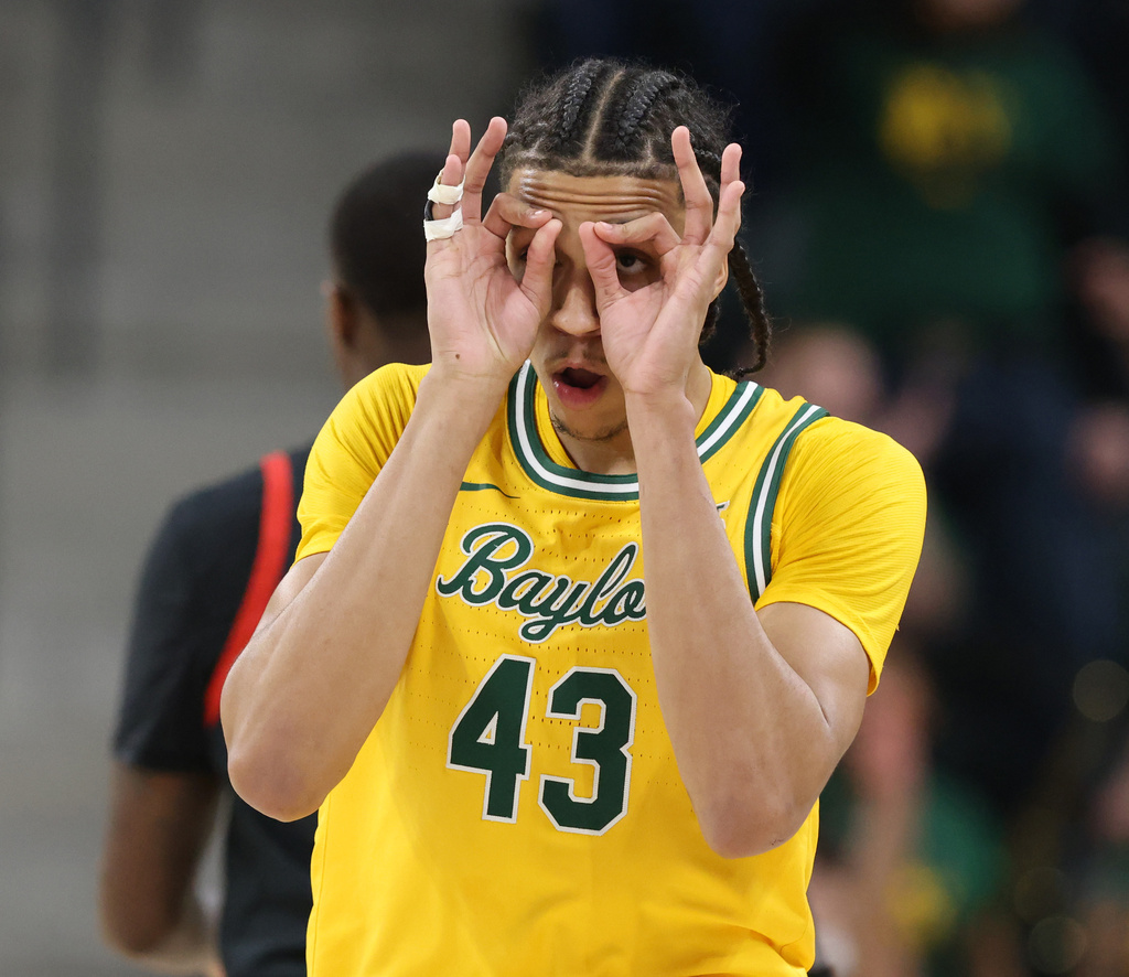 Baylor guard Cameron Carr reacts to his three-point shot against Utah in the first half of an NCAA college basketball game, Saturday, March 7, 2026, in Waco, Texas. (Rod Aydelotte/Waco Tribune-Herald via AP)