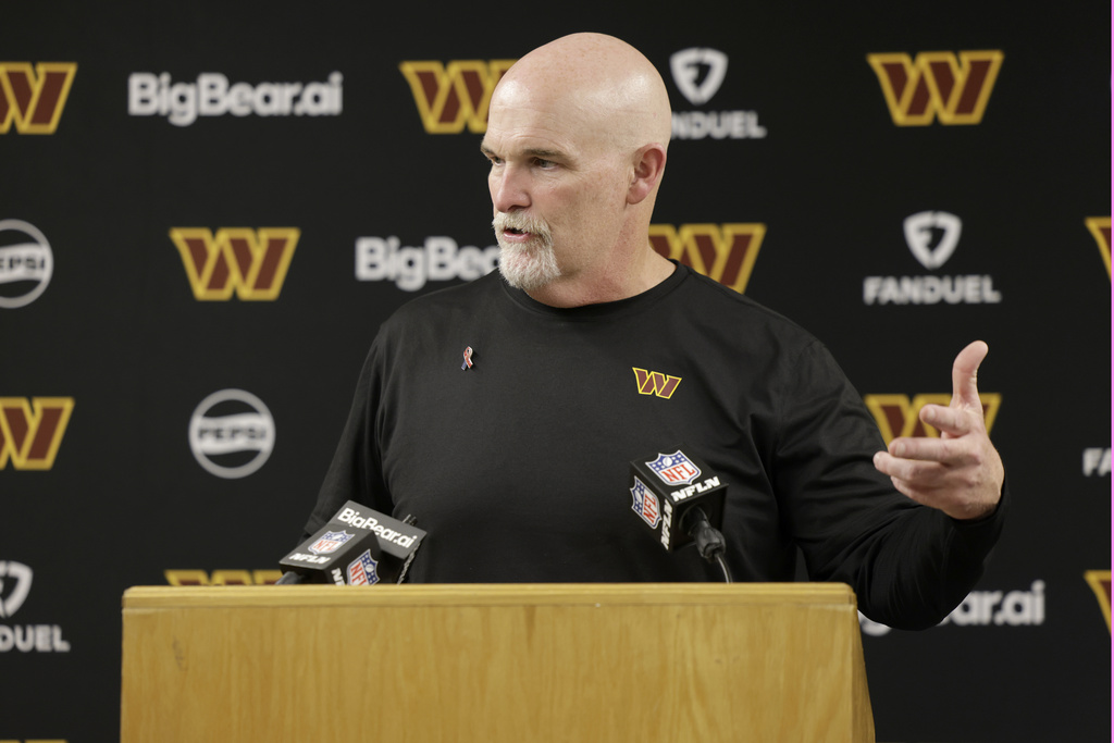 Washington Commanders head coach Dan Quinn speaks during a news conference following an NFL football game against the Green Bay Packers Thursday, Sept. 11, 2025, in Green Bay, Wis. (AP Photo/Matt Ludtke)